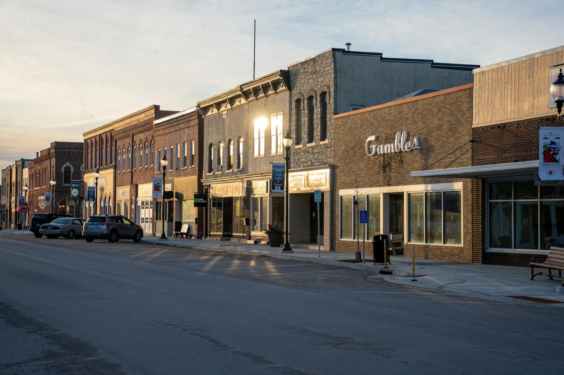 Historic brick storefronts on a Main Street similar to Old Town Warrenton