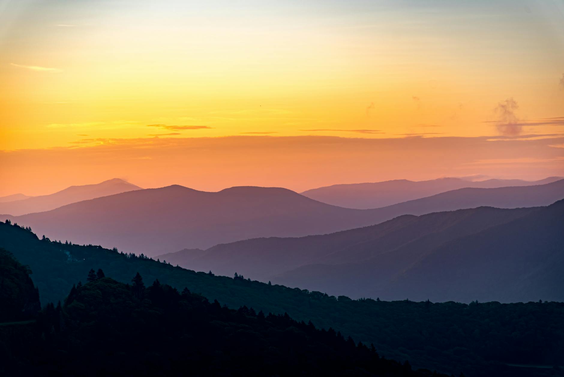 Blue Ridge mountains silhouetted against a soft evening sky