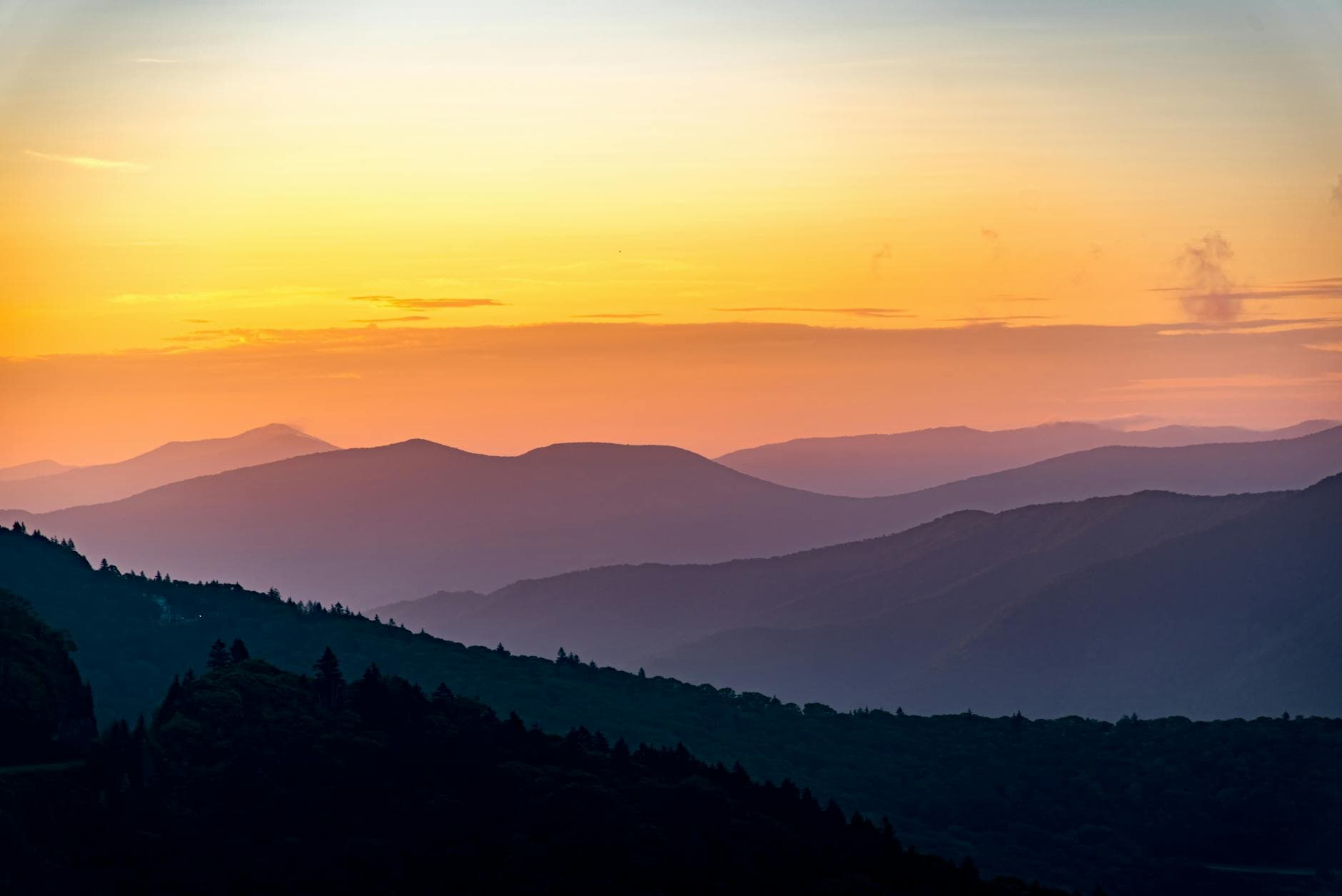 Blue Ridge mountains silhouetted against a soft evening sky